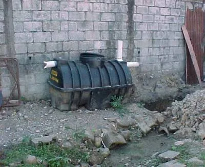 Septic tank example used to explain maintenance and pumping access.